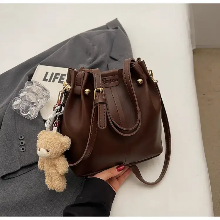 Women's Brown Leather Shoulder Bag with Pom Pom Charm — feature 21