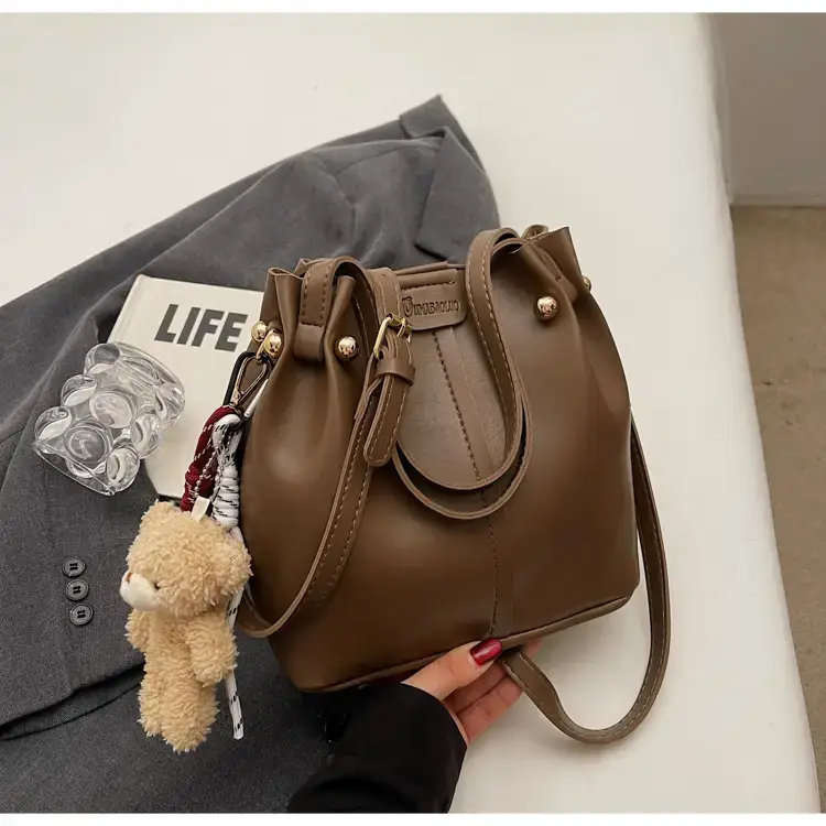 Women's Brown Leather Shoulder Bag with Pom Pom Charm — feature 23