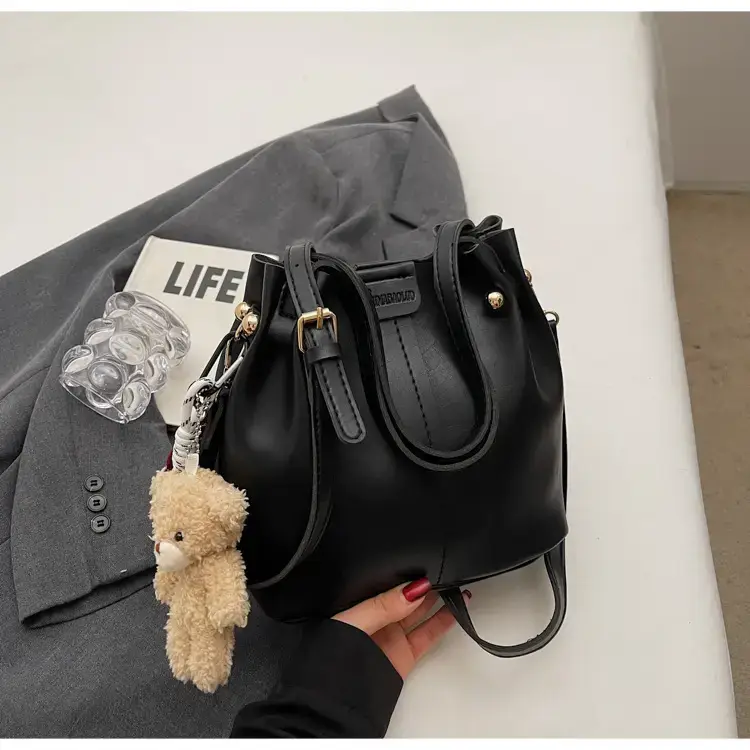 Women's Brown Leather Shoulder Bag with Pom Pom Charm — feature 24