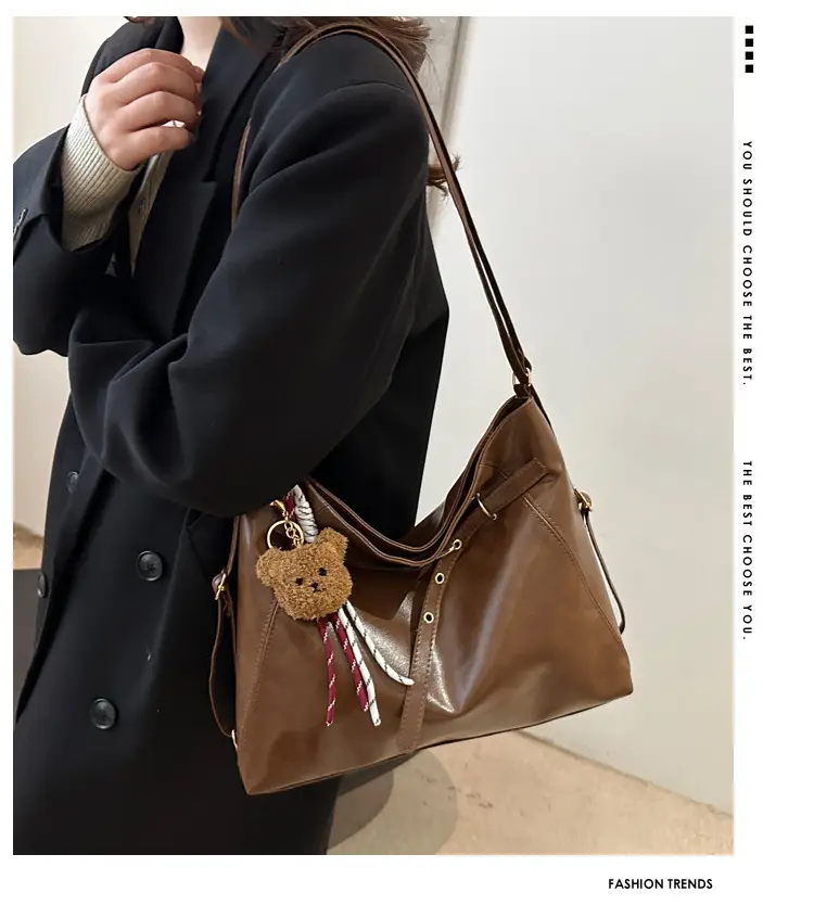 Brown Leather Shoulder Bag with Tassel Decor — feature 1