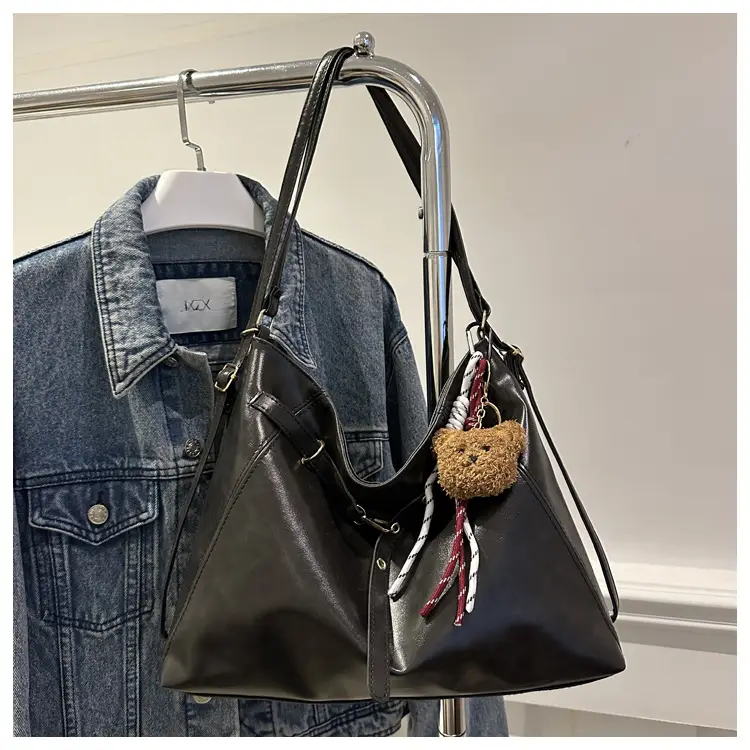 Brown Leather Shoulder Bag with Tassel Decor — feature 10