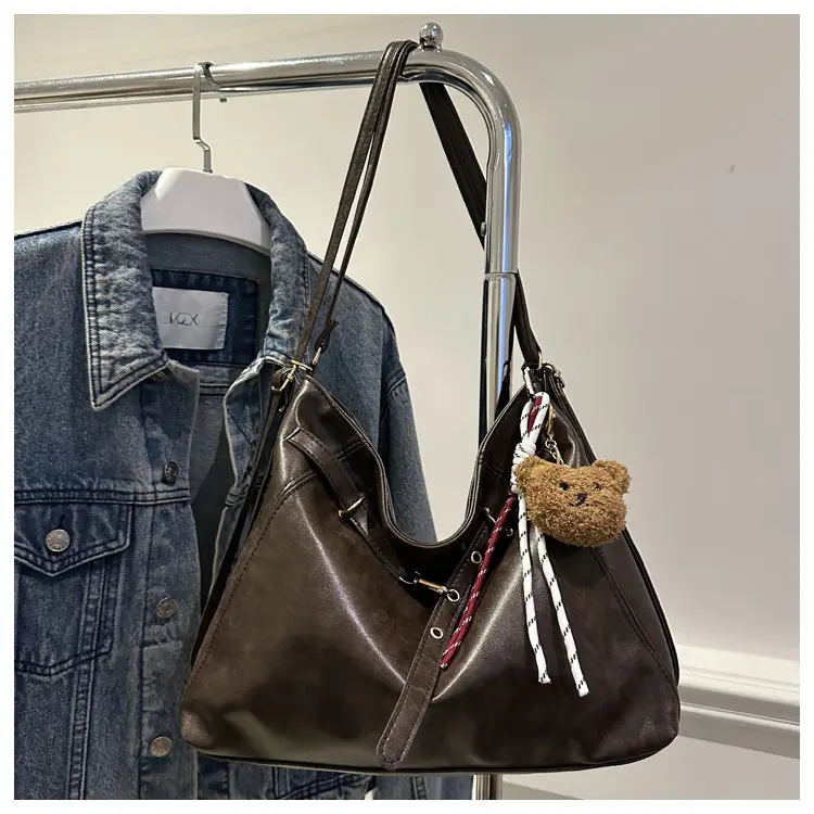 Brown Leather Shoulder Bag with Tassel Decor — feature 11