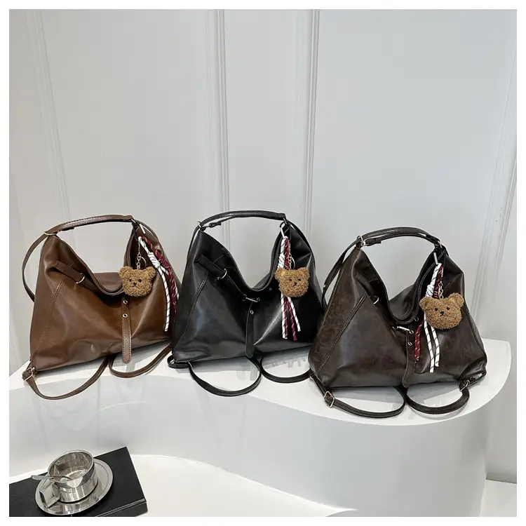 Brown Leather Shoulder Bag with Tassel Decor — feature 12