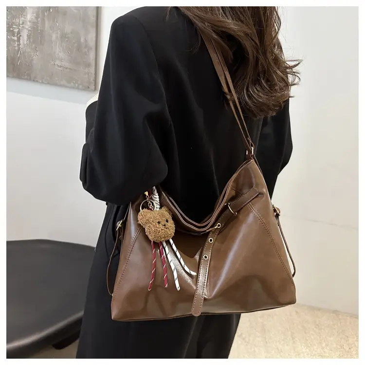 Brown Leather Shoulder Bag with Tassel Decor — feature 13