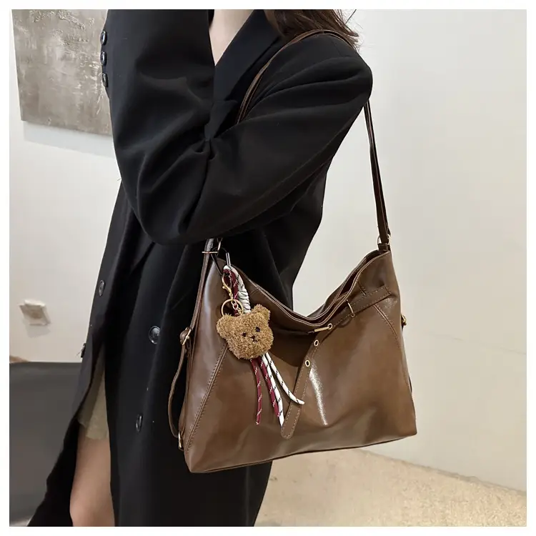 Brown Leather Shoulder Bag with Tassel Decor — feature 14