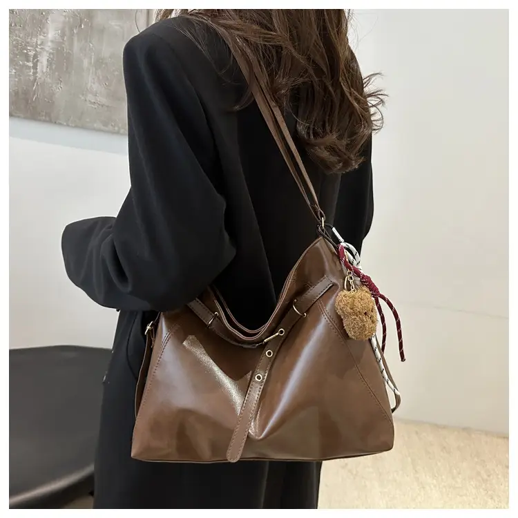 Brown Leather Shoulder Bag with Tassel Decor — feature 15