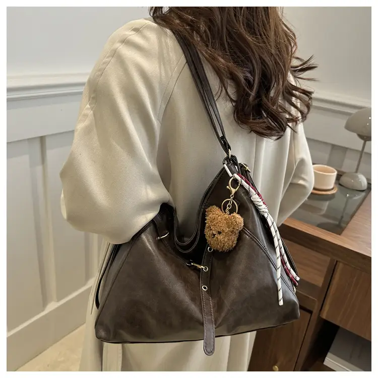 Brown Leather Shoulder Bag with Tassel Decor — feature 16