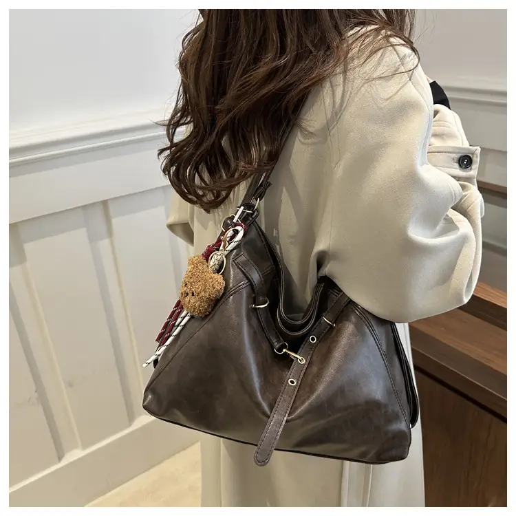 Brown Leather Shoulder Bag with Tassel Decor — feature 18