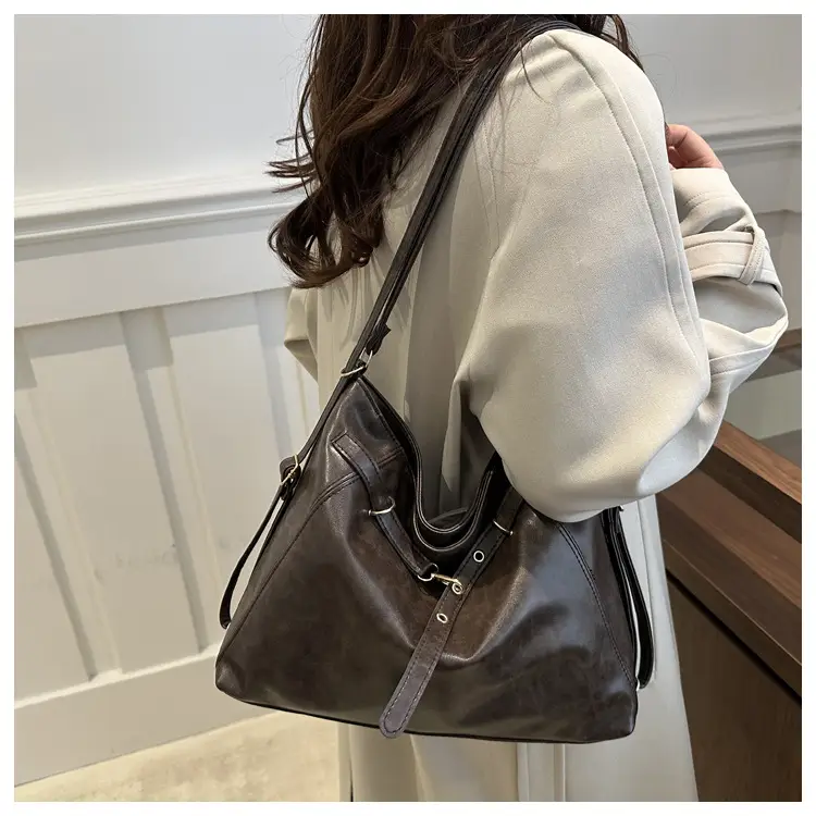 Brown Leather Shoulder Bag with Tassel Decor — feature 19