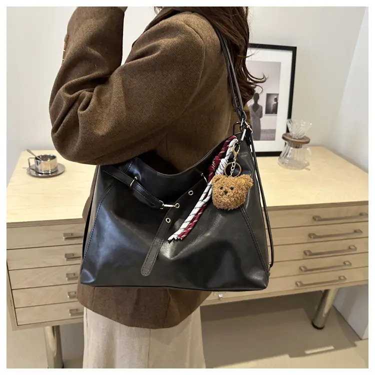 Brown Leather Shoulder Bag with Tassel Decor — feature 21