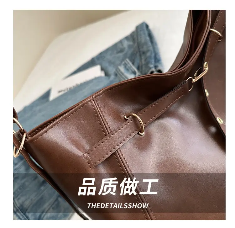 Brown Leather Shoulder Bag with Tassel Decor — feature 6