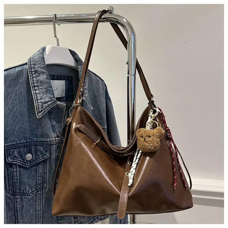 Brown Leather Shoulder Bag with Tassel Decor — feature 9