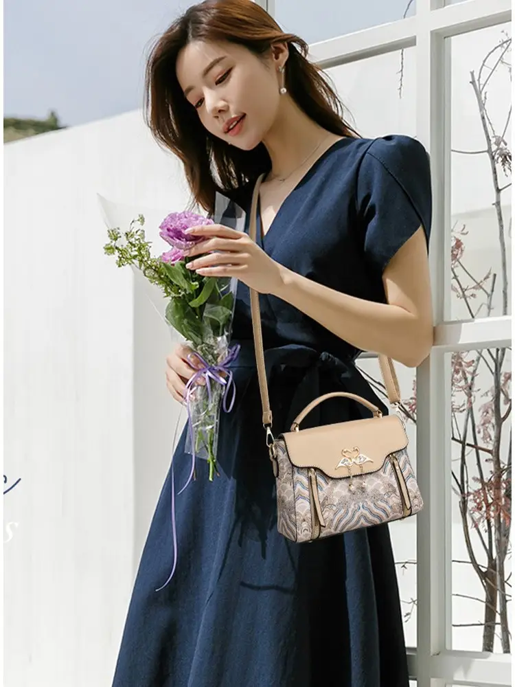 Women's Black Leather Crossbody Bag with Red Accessories