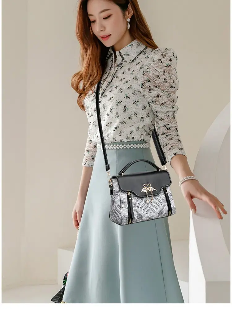 Women's Black Leather Crossbody Bag with Red Accessories