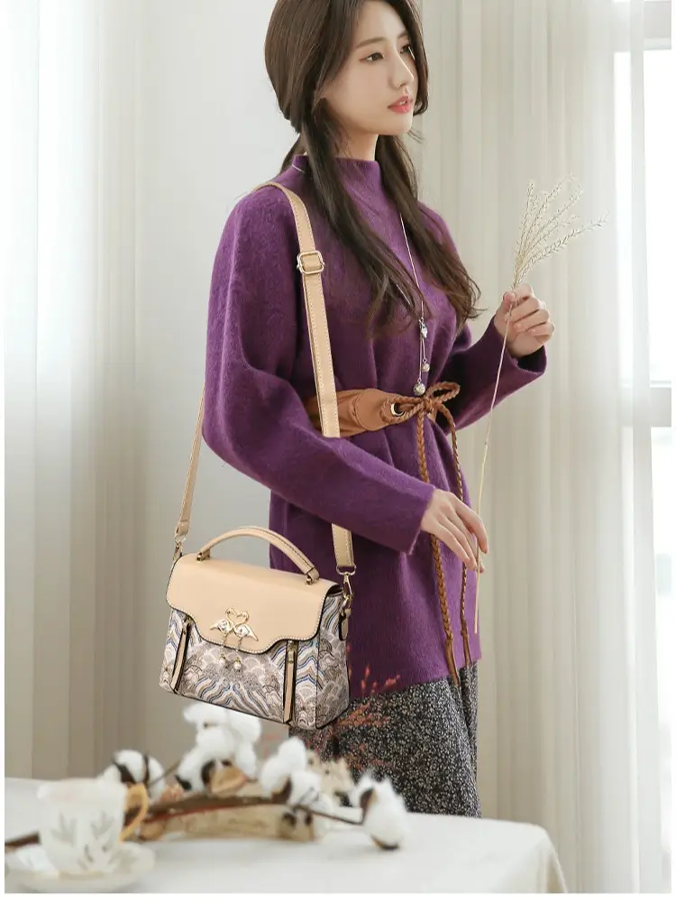 Women's Black Leather Crossbody Bag with Red Accessories