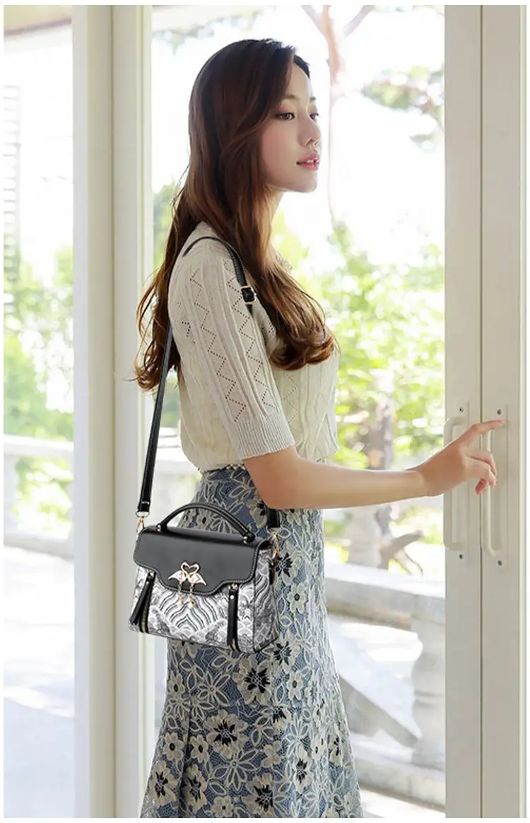 Women's Black Leather Crossbody Bag with Red Accessories — feature 16
