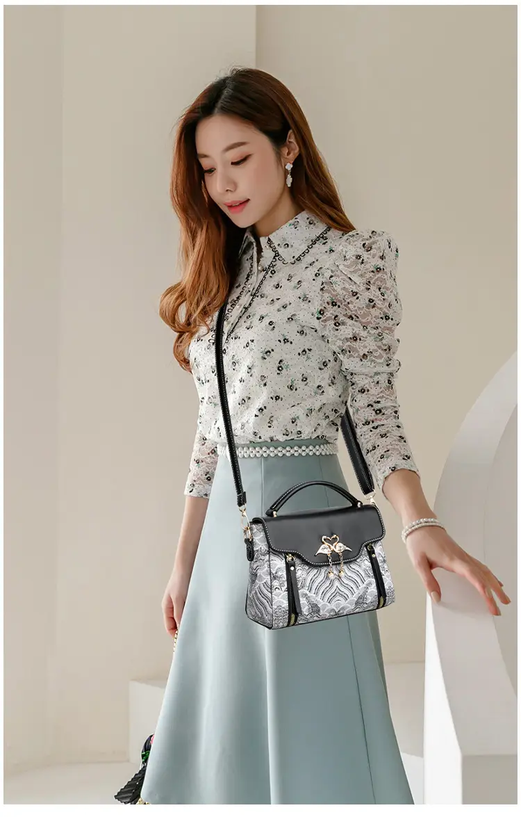 Women's Black Leather Crossbody Bag with Red Accessories — feature 19