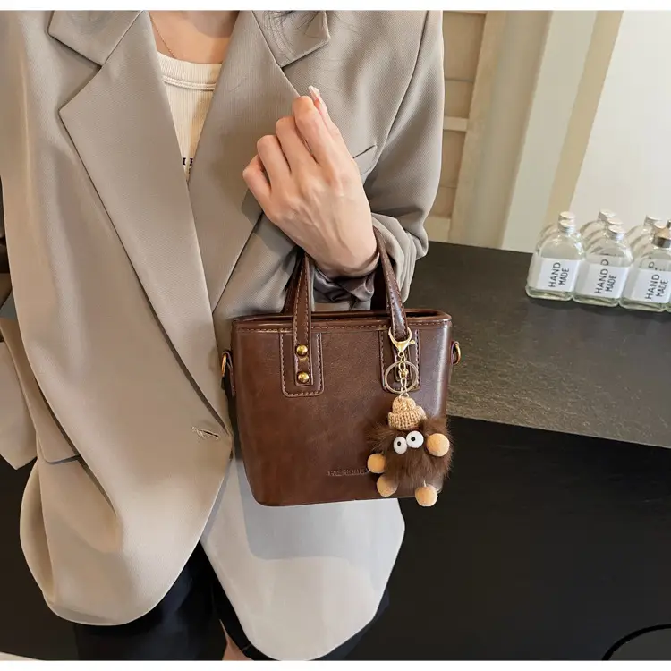 Women's Small Square Handbag with Pom Pom Detail — feature 31