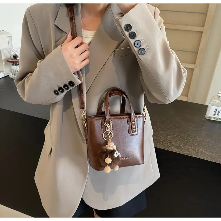 Women's Small Square Handbag with Pom Pom Detail — feature 34