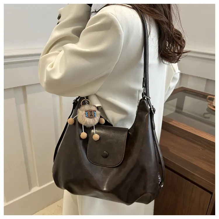 Retro Black Crossbody Bag with Doll Keychain 2024 — feature 17