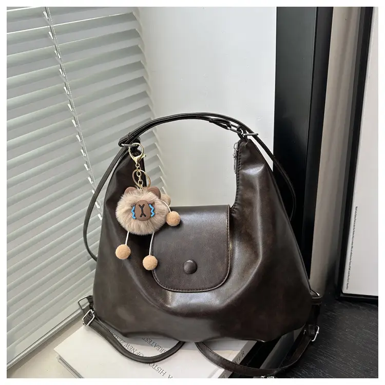 Retro Black Crossbody Bag with Doll Keychain 2024 — feature 9