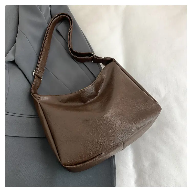 Large Capacity Brown Leather Shoulder Bag with Cute Charm — feature 34