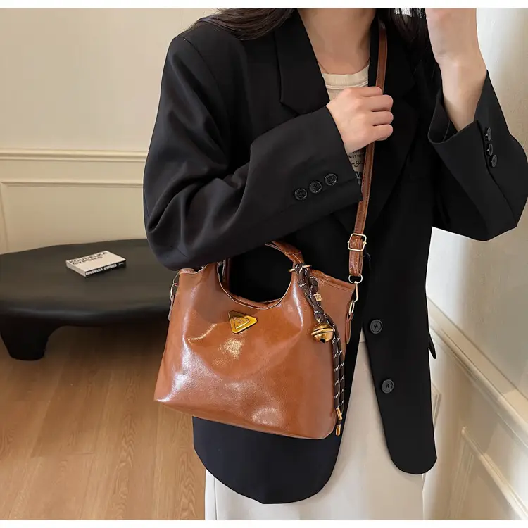 Retro Brown Bucket Bag with Gold Plated Logo — feature 16