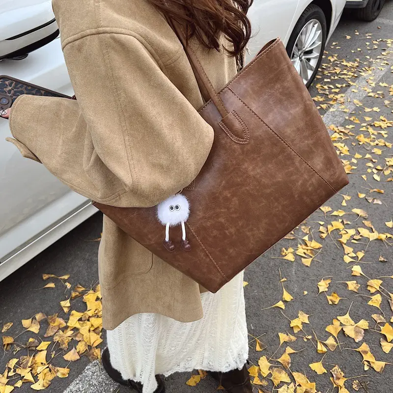 Retro Brown Leather Shoulder Bag with Pom Pom Charm - Image 10