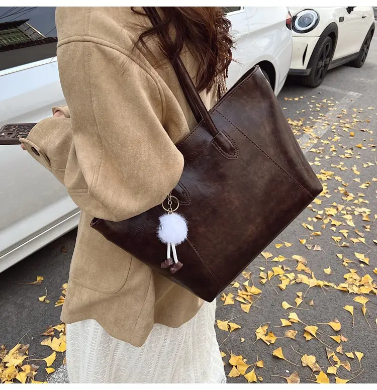 Retro Brown Leather Shoulder Bag with Pom Pom Charm — feature 17