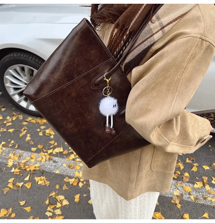 Retro Brown Leather Shoulder Bag with Pom Pom Charm — feature 18