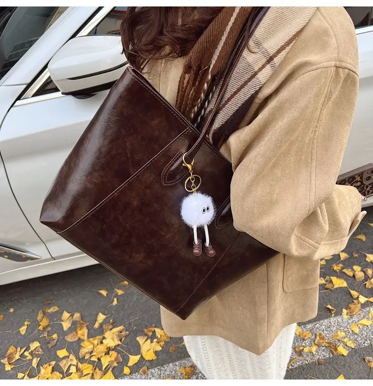 Retro Brown Leather Shoulder Bag with Pom Pom Charm — feature 19
