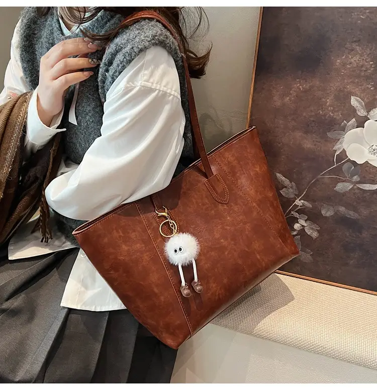 Retro Brown Leather Shoulder Bag with Pom Pom Charm — feature 22