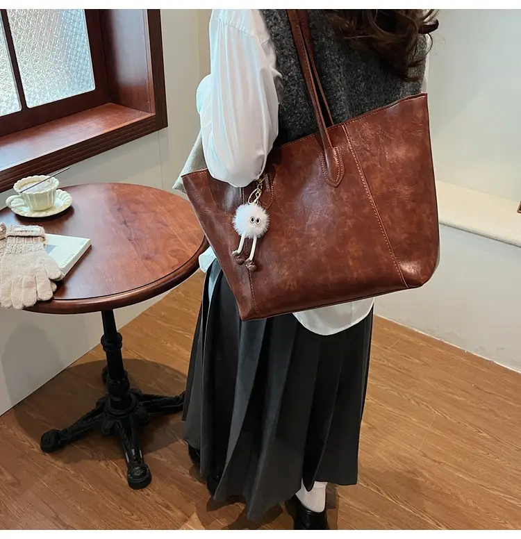 Retro Brown Leather Shoulder Bag with Pom Pom Charm — feature 23