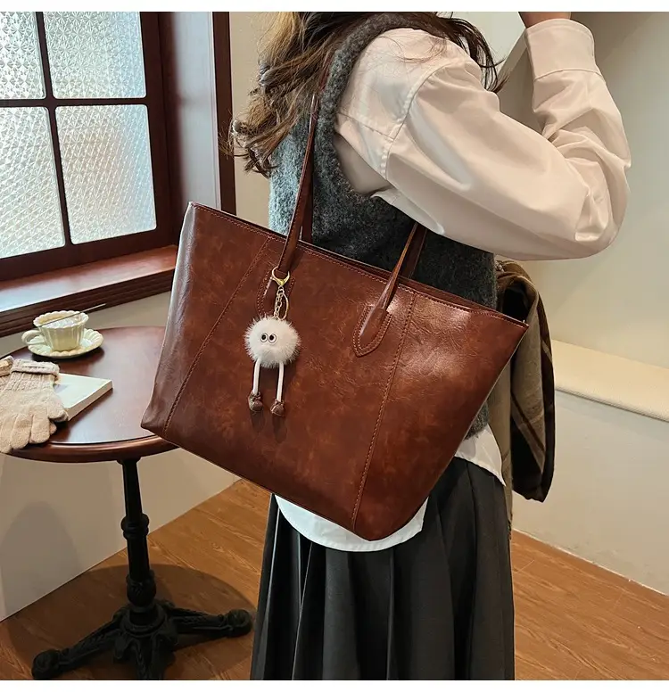 Retro Brown Leather Shoulder Bag with Pom Pom Charm — feature 24