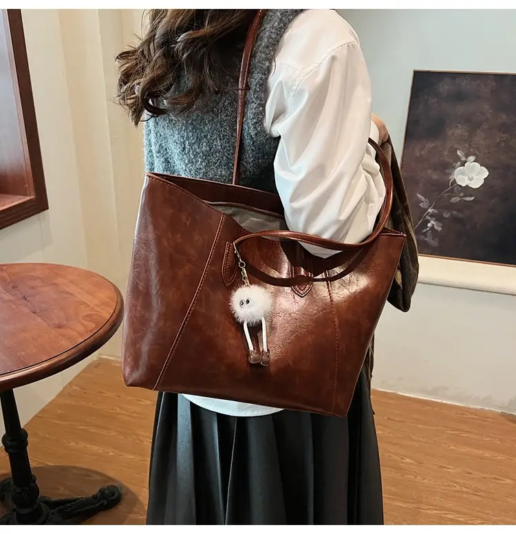 Retro Brown Leather Shoulder Bag with Pom Pom Charm — feature 25