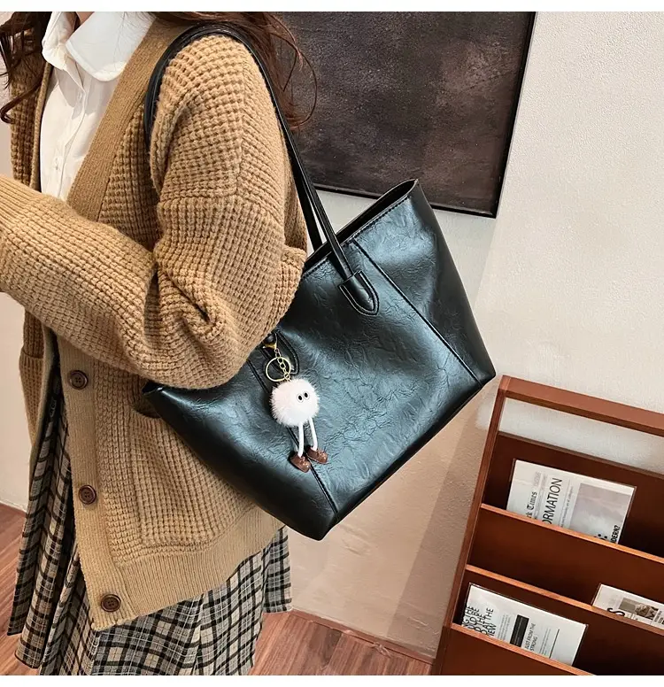 Retro Brown Leather Shoulder Bag with Pom Pom Charm — feature 27