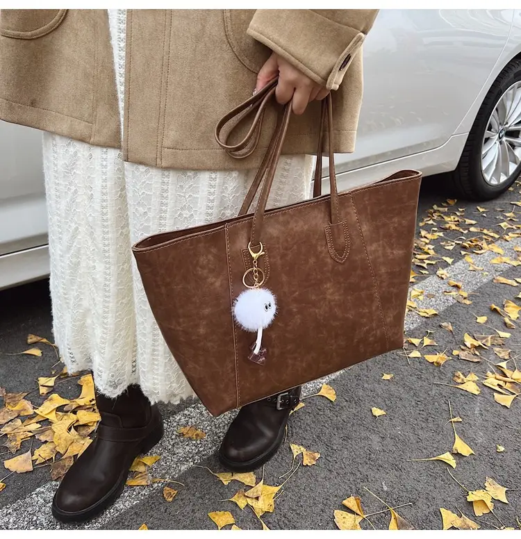 Retro Brown Leather Shoulder Bag with Pom Pom Charm — feature 31