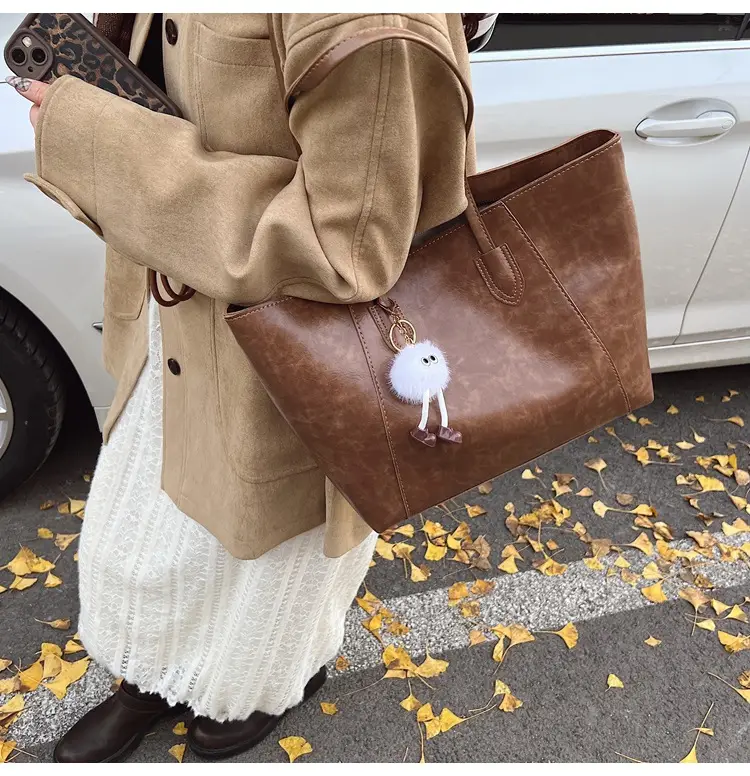 Retro Brown Leather Shoulder Bag with Pom Pom Charm — feature 32