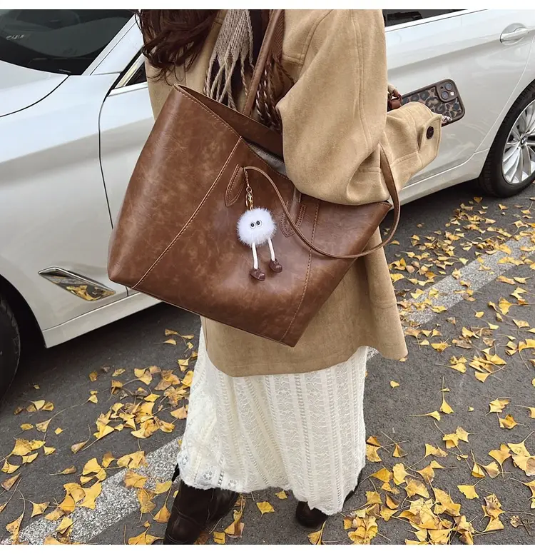 Retro Brown Leather Shoulder Bag with Pom Pom Charm — feature 33