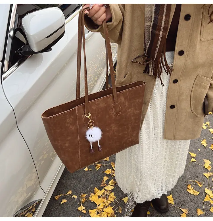 Retro Brown Leather Shoulder Bag with Pom Pom Charm — feature 34