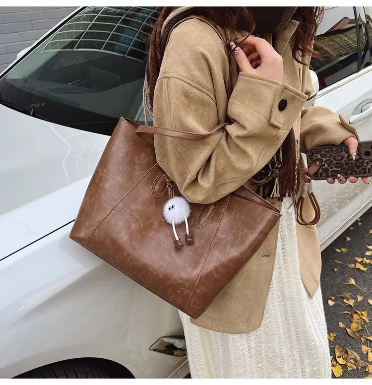 Retro Brown Leather Shoulder Bag with Pom Pom Charm — feature 35