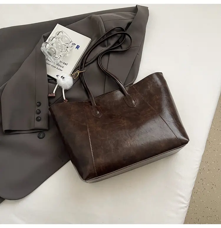 Retro Brown Leather Shoulder Bag with Pom Pom Charm — feature 39
