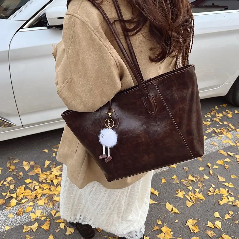 Retro Brown Leather Shoulder Bag with Pom Pom Charm - Image 2
