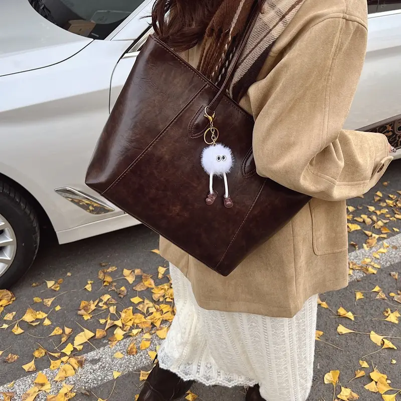 Retro Brown Leather Shoulder Bag with Pom Pom Charm - Image 6