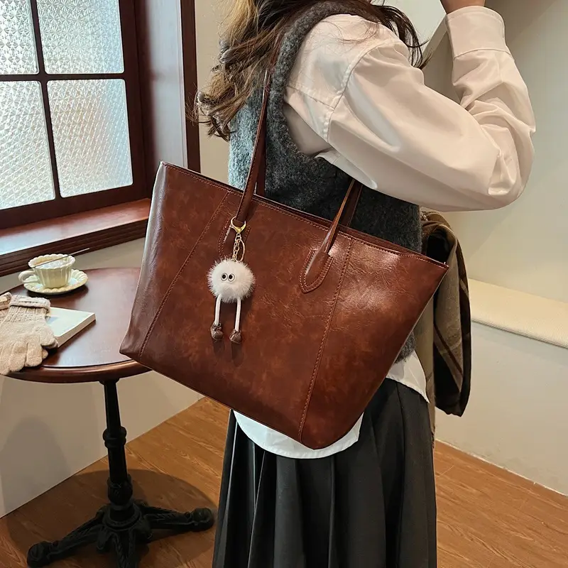 Retro Brown Leather Shoulder Bag with Pom Pom Charm - Image 8