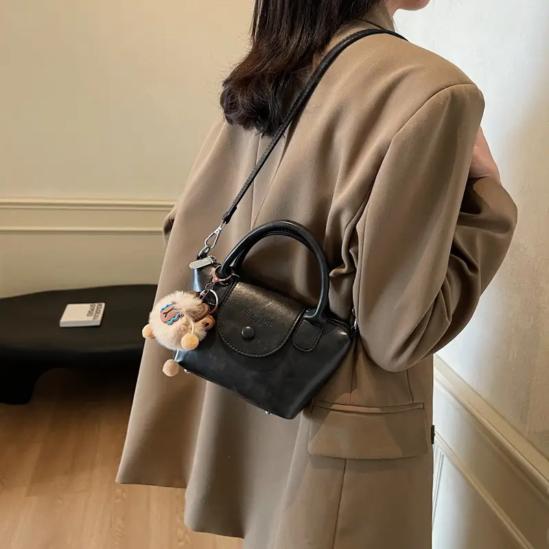 Women's Black Leather Shoulder Bag with Cute Pom Pom Charm - Image 6