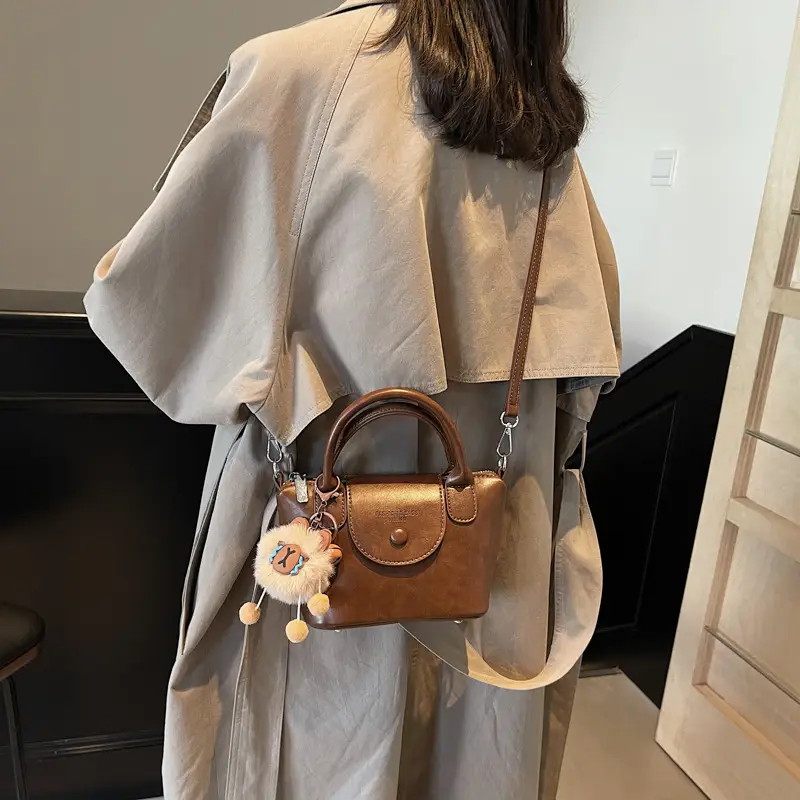 Women's Black Leather Shoulder Bag with Cute Pom Pom Charm - Image 7