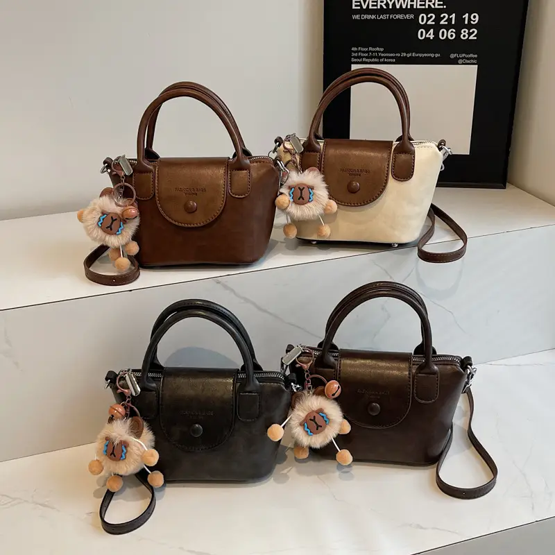 Women's Black Leather Shoulder Bag with Cute Pom Pom Charm - Image 8