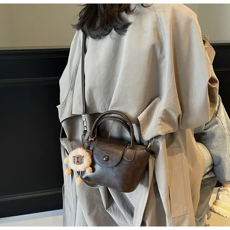 Women's Black Leather Shoulder Bag with Cute Pom Pom Charm — feature 34