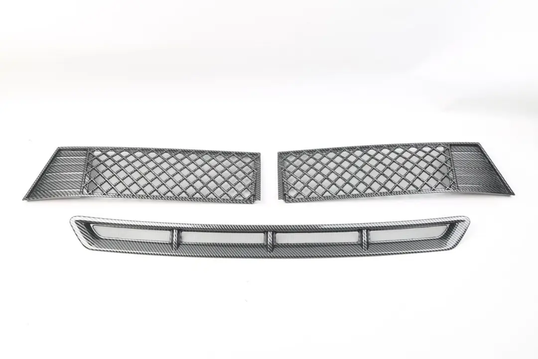 Two mesh grille panels and a long lower trim piece on a white background.